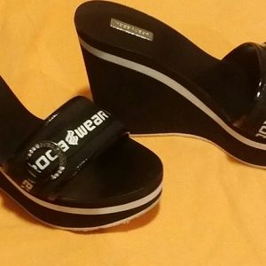 A pair of Roca a wear wedged sandal